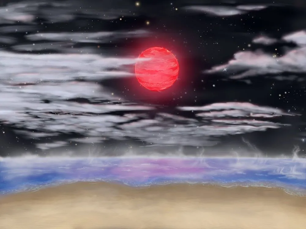 赤い月と海辺の夜景