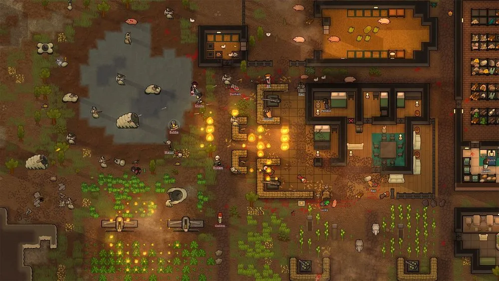 RimWorldのゲーム画面。炎上する防衛拠点と入植者たち
